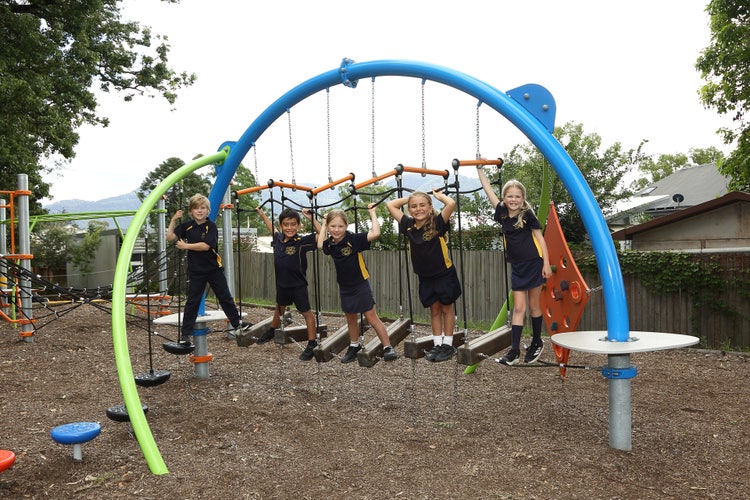 5 students from Kangaroo Valley Public School playing on the playground equipment